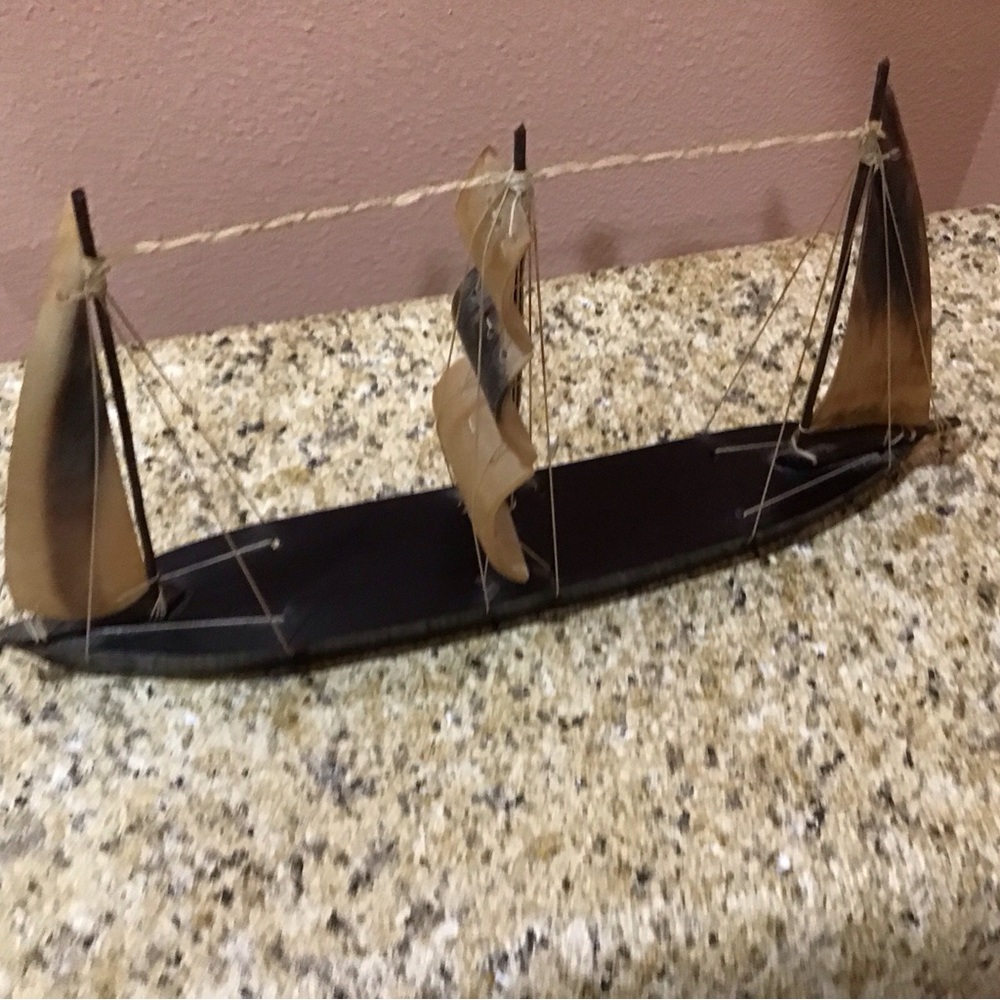 A Miniature  Decorative Black Wooden Sailboat  With Hard Plastic Three Sails